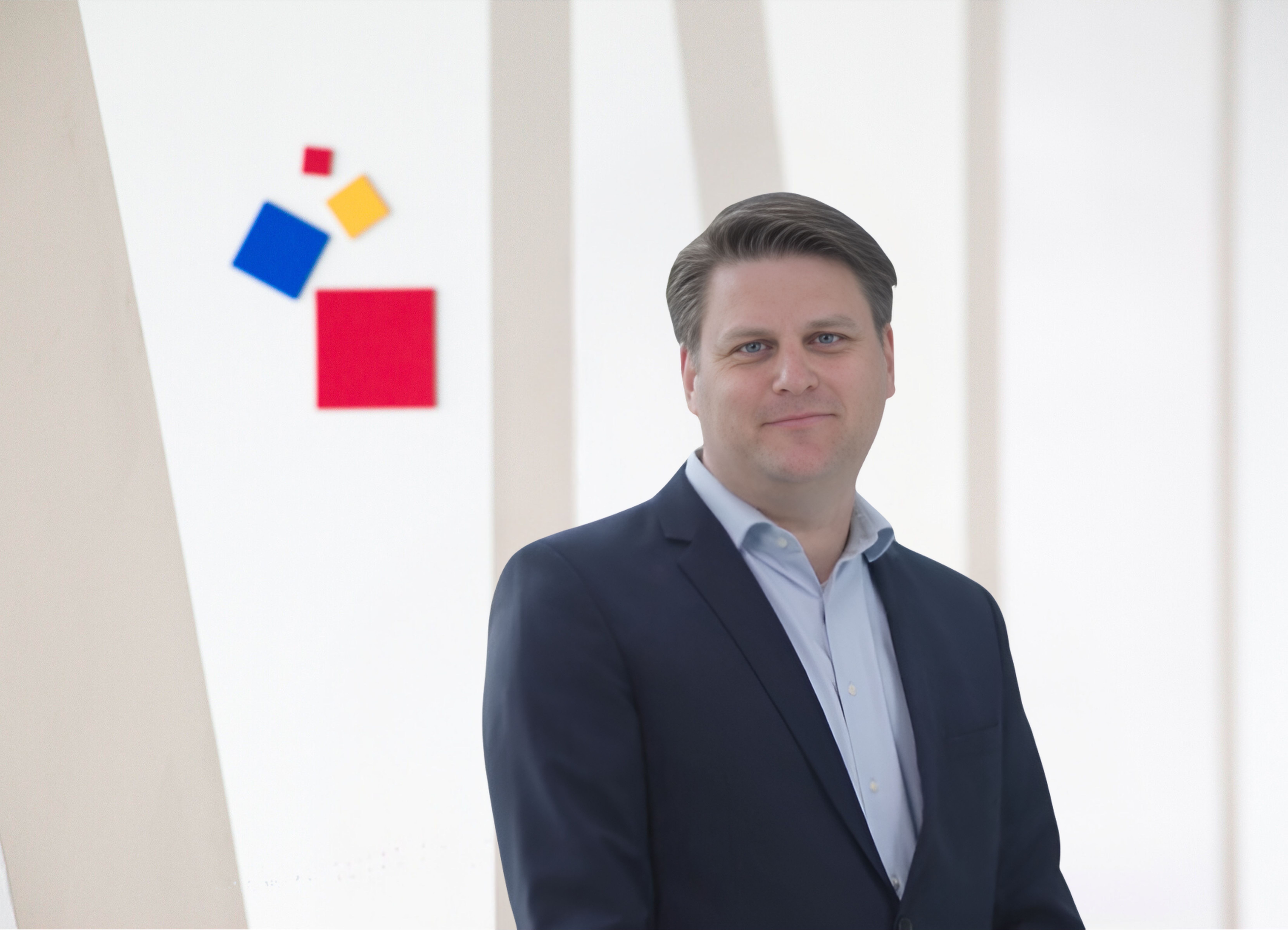 Constantin von Vieregge President & CEO Business professional posing in front of Messe Frankfurt's logo backdrop