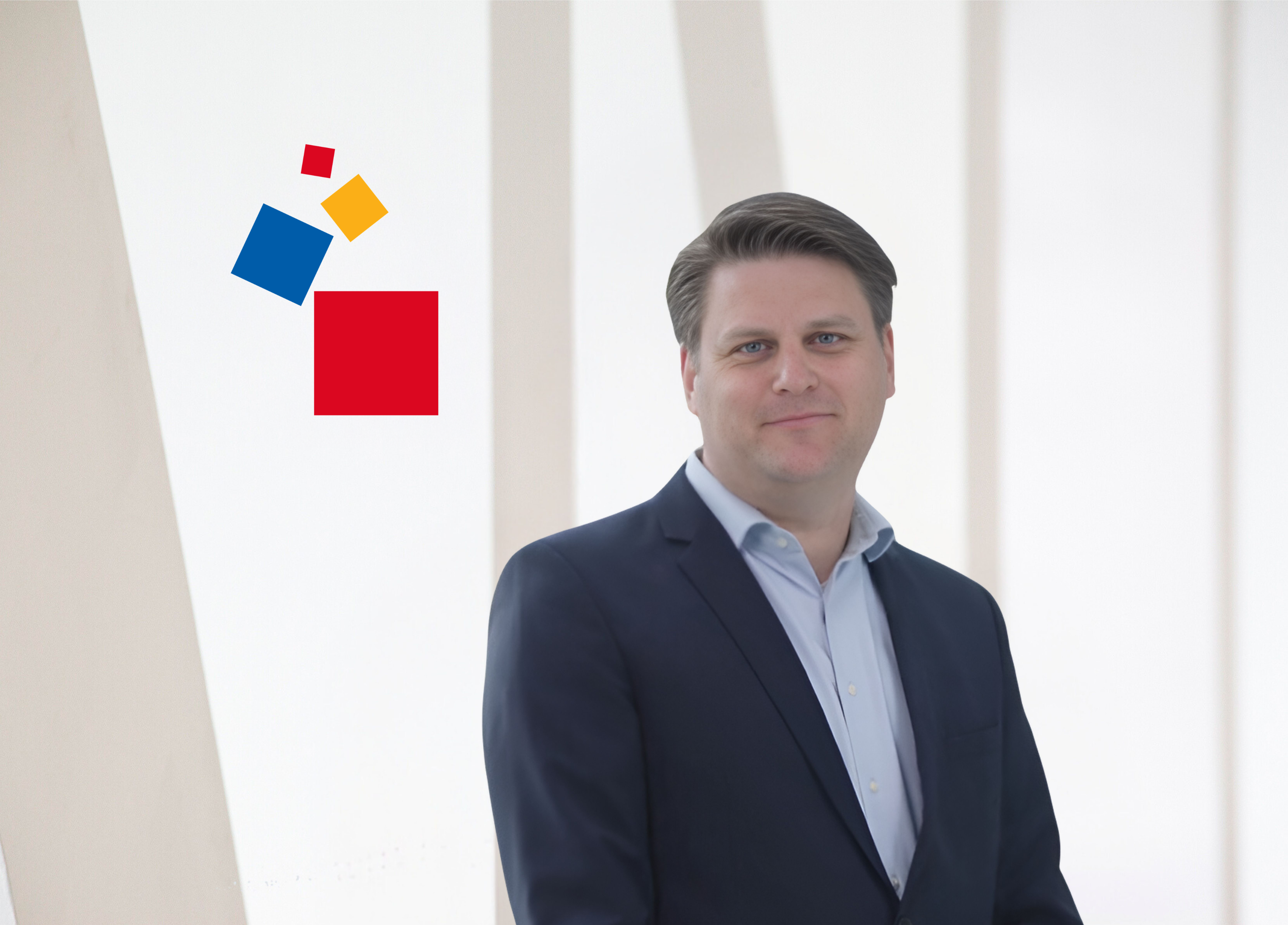 Constantin von Vieregge President & CEO Business professional posing in front of Messe Frankfurt's logo backdrop