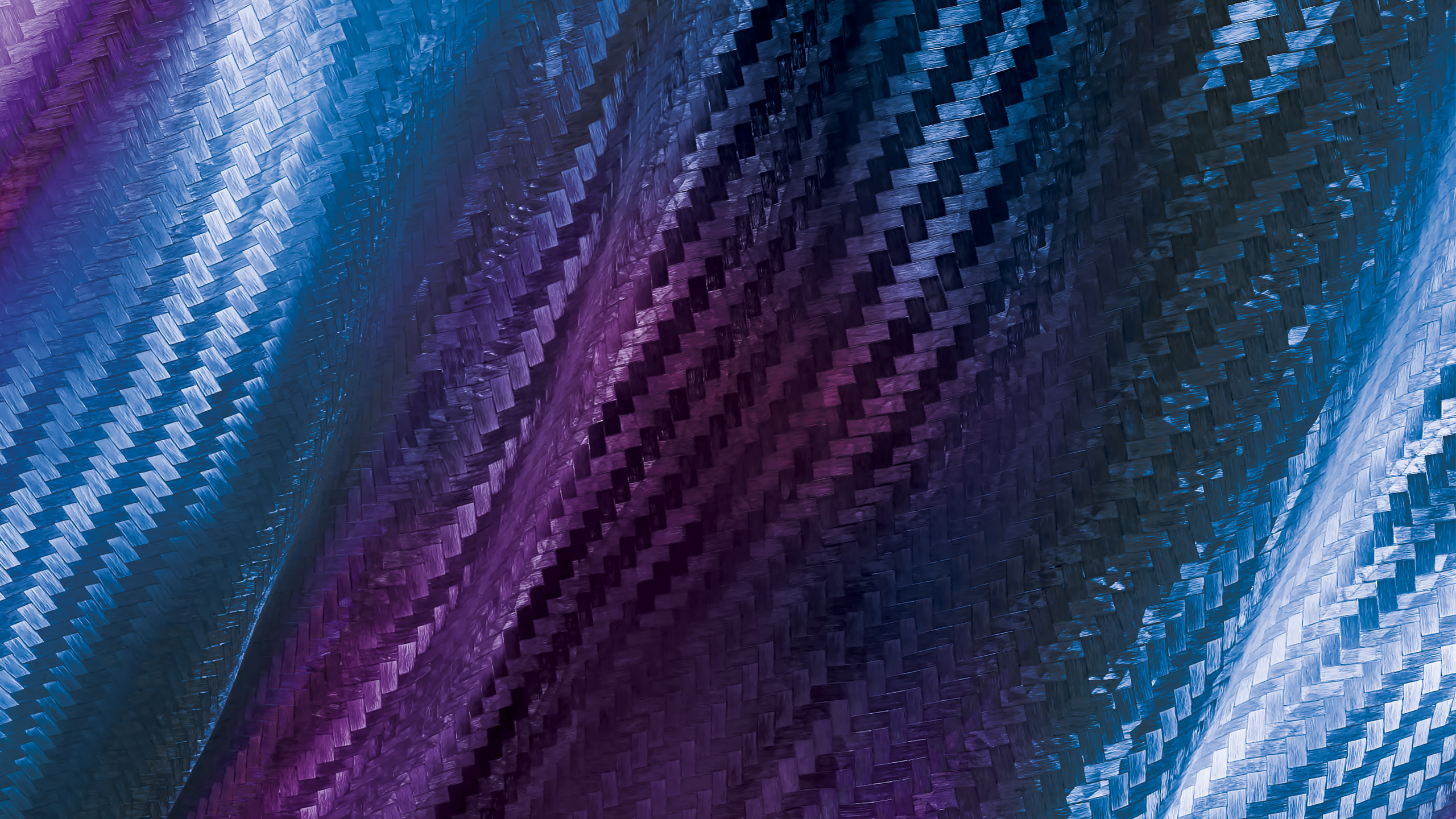 Close-up view of woven textile fabric in blue and purple hues, showcasing the texture and pattern of the material Techtextil North America